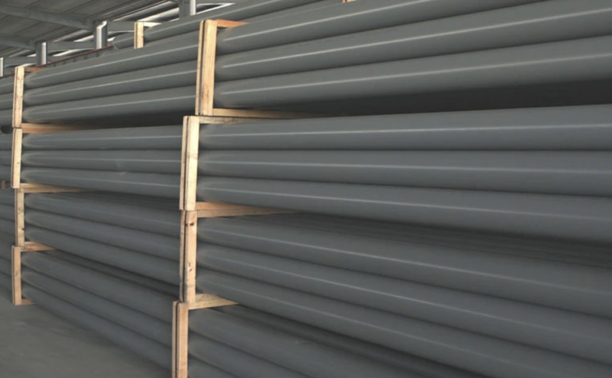Heavy-Duty SWR Drainage Pipes and Bundled Fittings in Wooden Crates at Stellar Pipes Plant